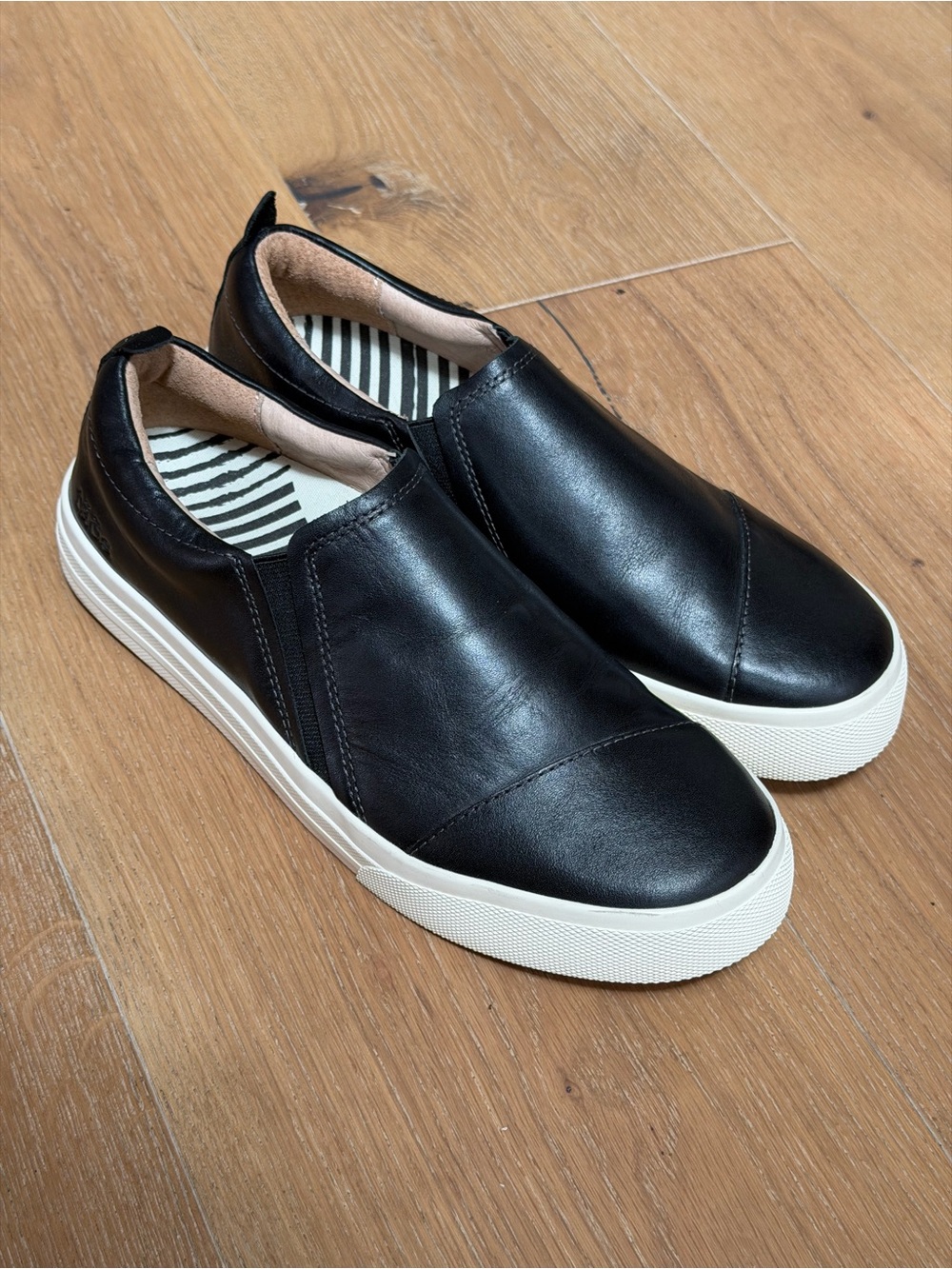 Taos Footwear Black Slip-On Leather Sneakers with White Sole